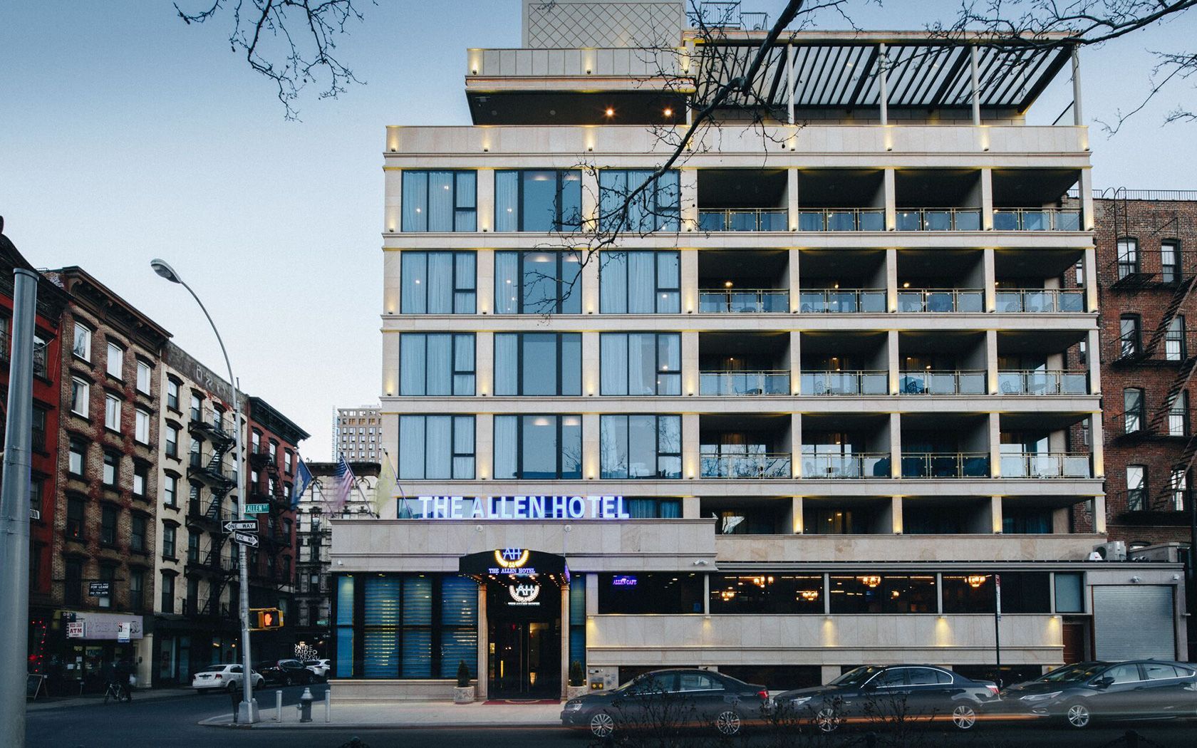 The Mercer Hotel, a multi-story building with a facade of windows, street view.