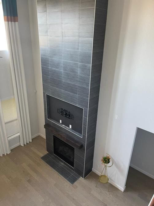 There is a fireplace in the middle of the room.