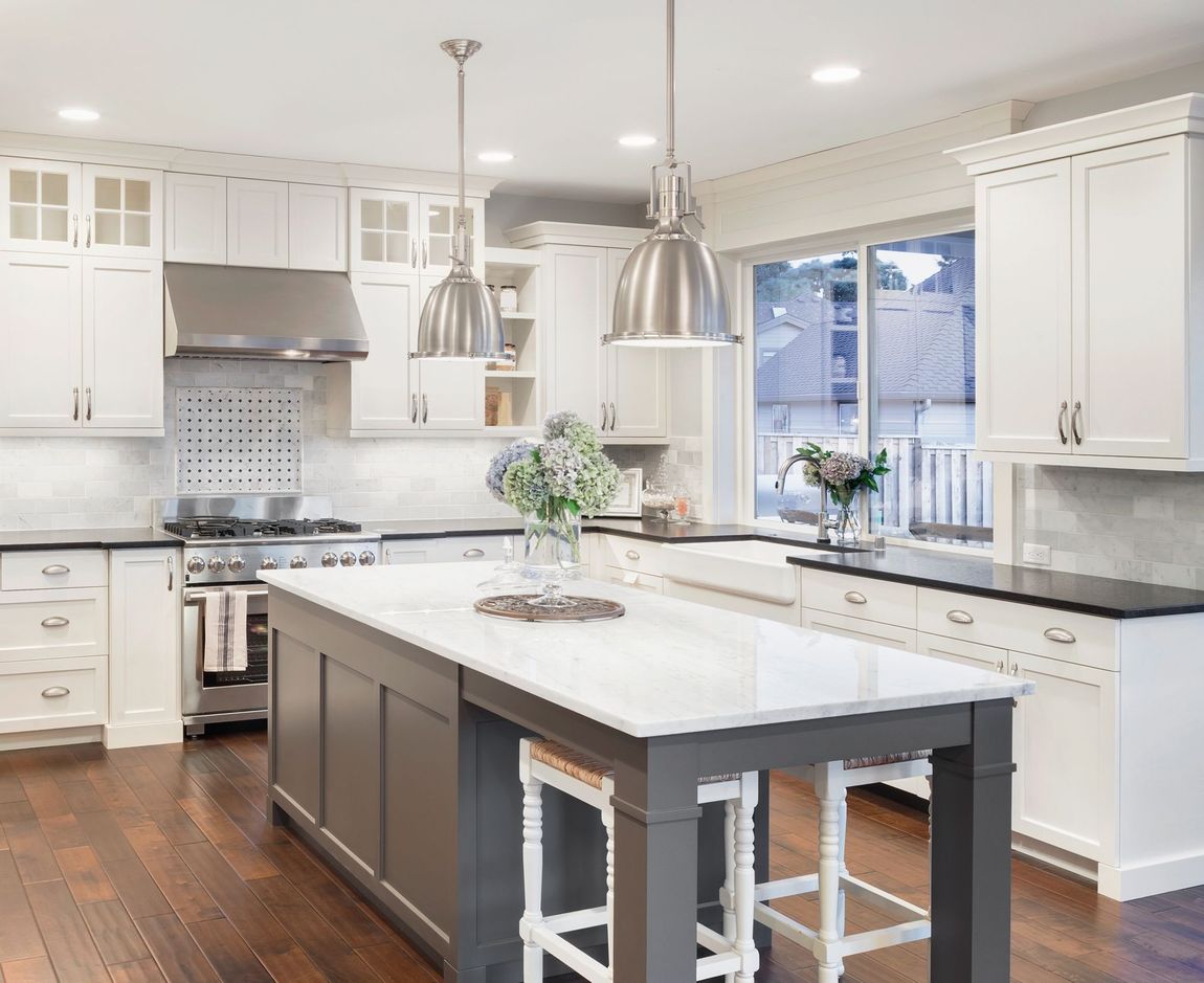 There is a large island in the middle of the kitchen.