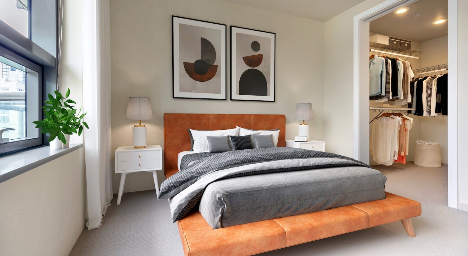 Bedroom with orange upholstered bed, two white nightstands, lamps, and open walk-in closet.