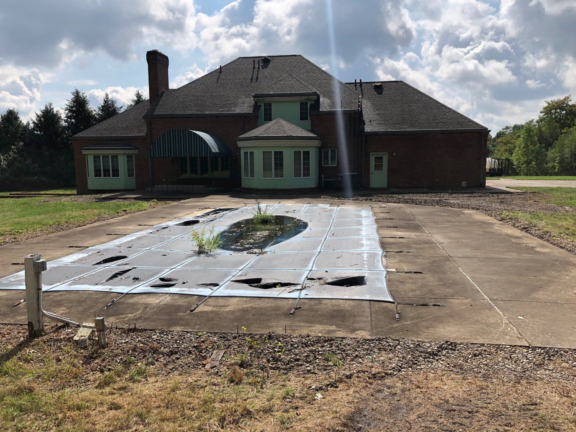 Before Pool Cleaning Of Old House — Homer City, PA — Awesome Exteriors Pressure Washing LLC