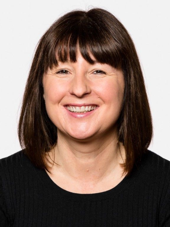 A light gray, stylized icon of a human head and shoulders centered on a white background.