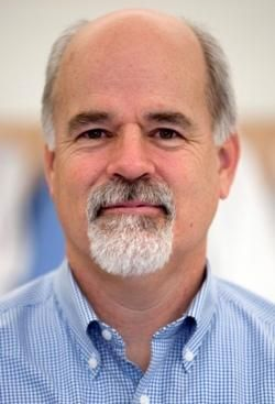 A light gray, stylized icon of a human head and shoulders centered on a white background.