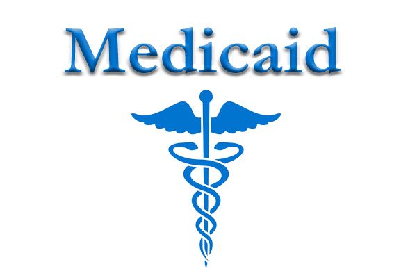 A blue caduceus symbol with the word medicaid below it