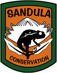 A logo for sandula conservation with a chameleon on a flower