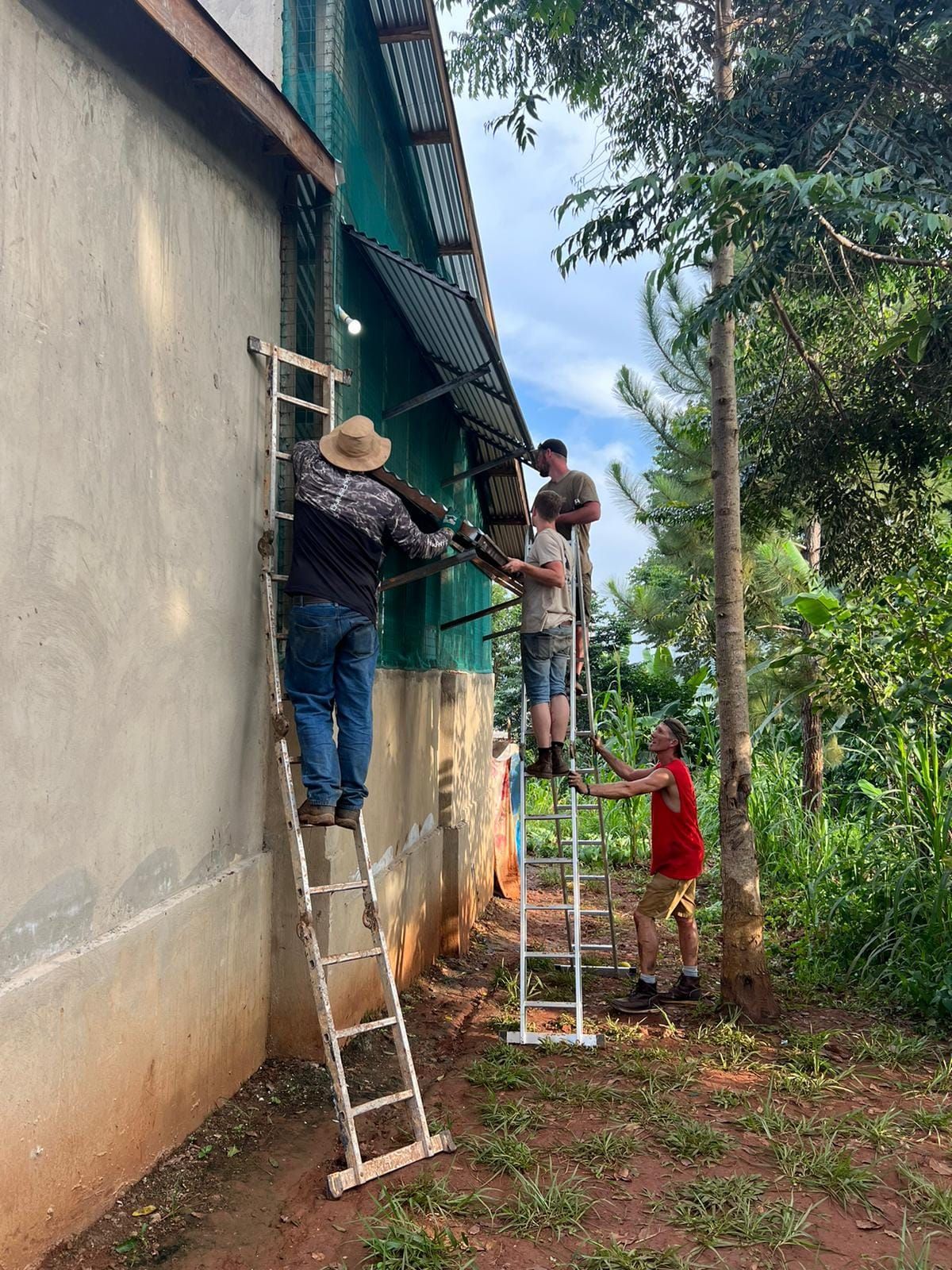 Zach and the local crew at work in Uganda