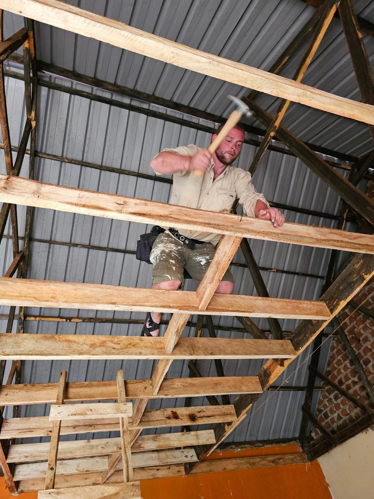 Zach framing a second floor in Uganda