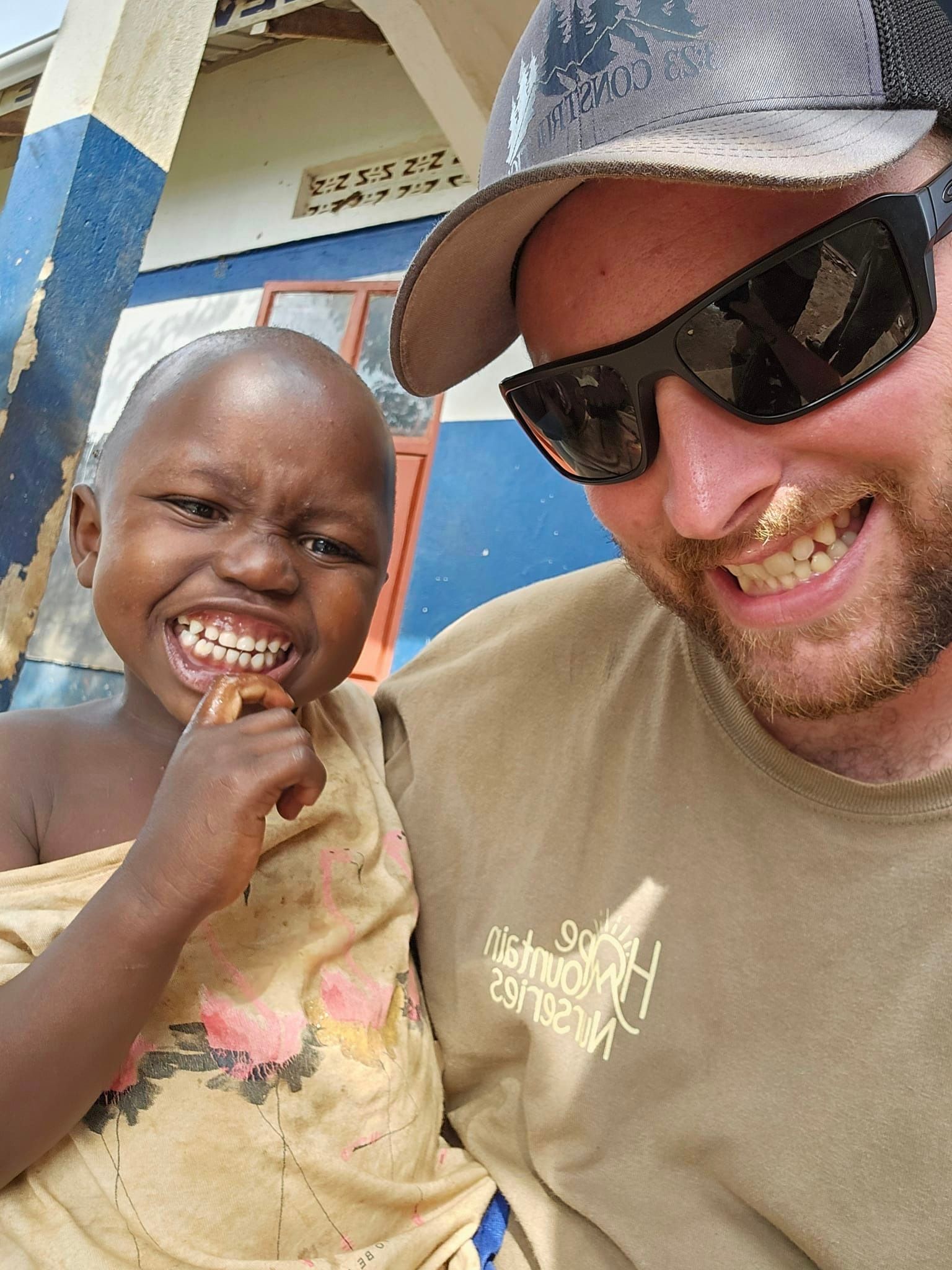 Zach making friends in Uganda