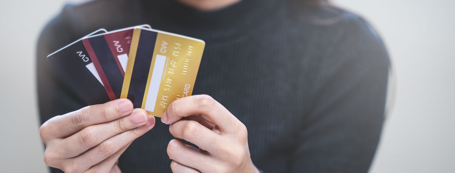 Balloons of varying blue hues surround a wall with logo that says 