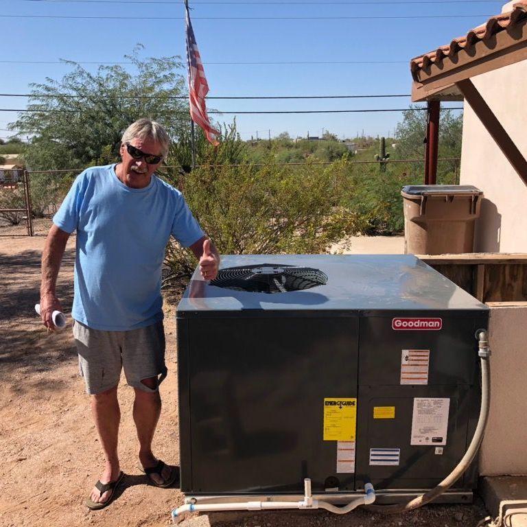 Client posing with a newly installed ac system
