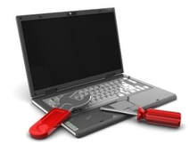 New Westminster Computer Repair logo of a silver laptop with red repair tools consisting of a red wrench and screw driver.