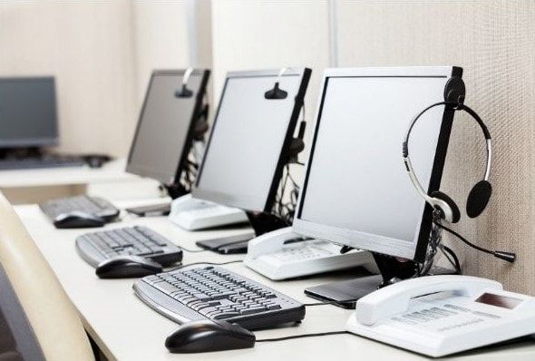 3 desktop computers, keyboards, monitors and mouse used to provide remote service to clients for trouble shooting and diagnosing