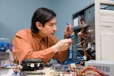 3 desktop computers, keyboards, monitors and mouse used to provide remote service to clients for trouble shooting and diagnosing