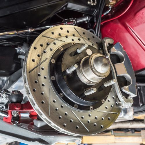 A close up of a brake disc on a car.