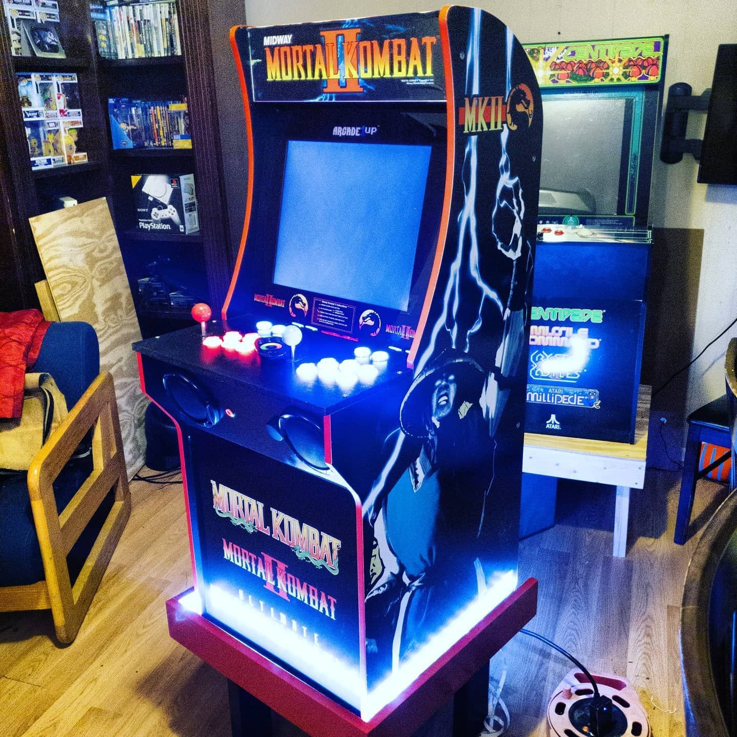 G&G Arcade Custom Cabinets | a video game called mortal kombat is sitting in a living room