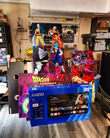 G&G Arcade Custom Cabinets | a room with a dragon ball z poster and a vizio tv