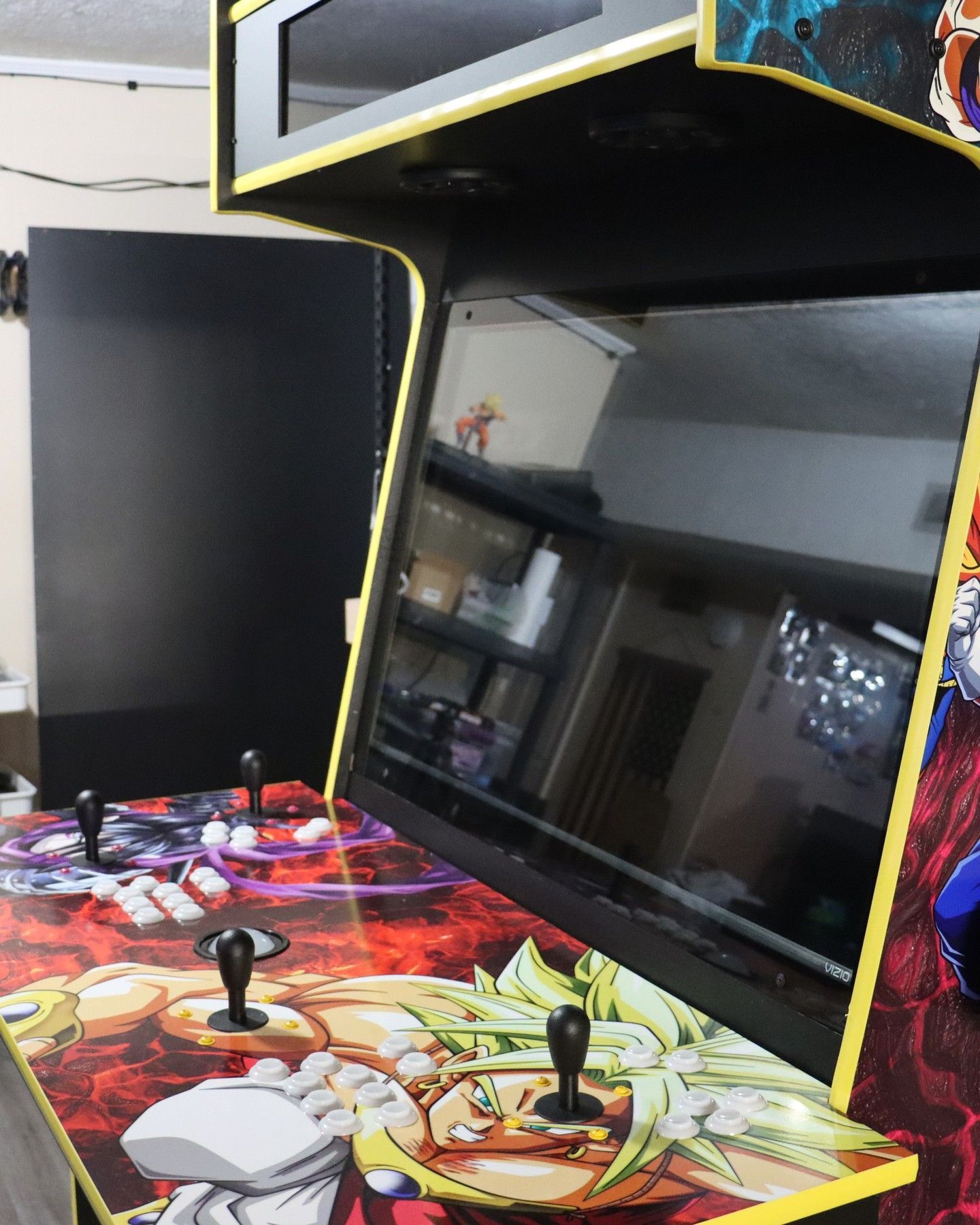 G&G Arcade Custom Cabinets | a video game with a picture of a dragon ball character on it