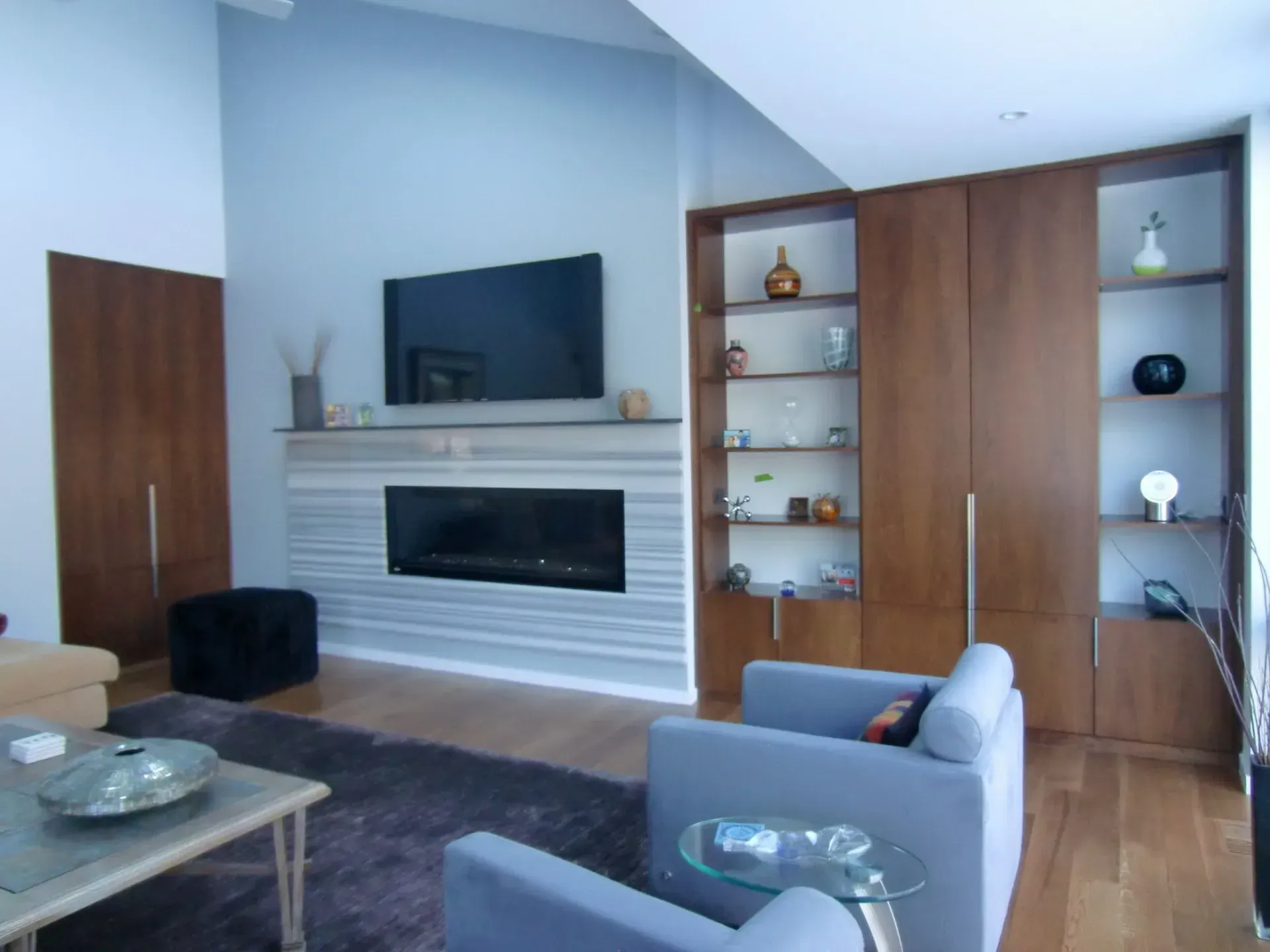 Walnut contemporary cases flanking fireplace - Bryn Mawr, PA