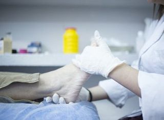 Diabetic Wound Care — Doctor Checking The Foot in Orlando, FL