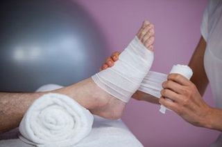 Neuromas — Nurse Putting Bandage On Foot in Orlando, FL