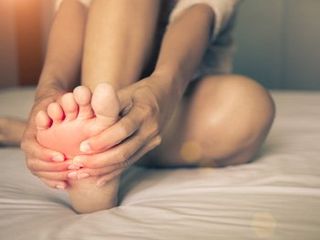 Foot Neuropathy — Woman Having Nerve Pain in Orlando, FL