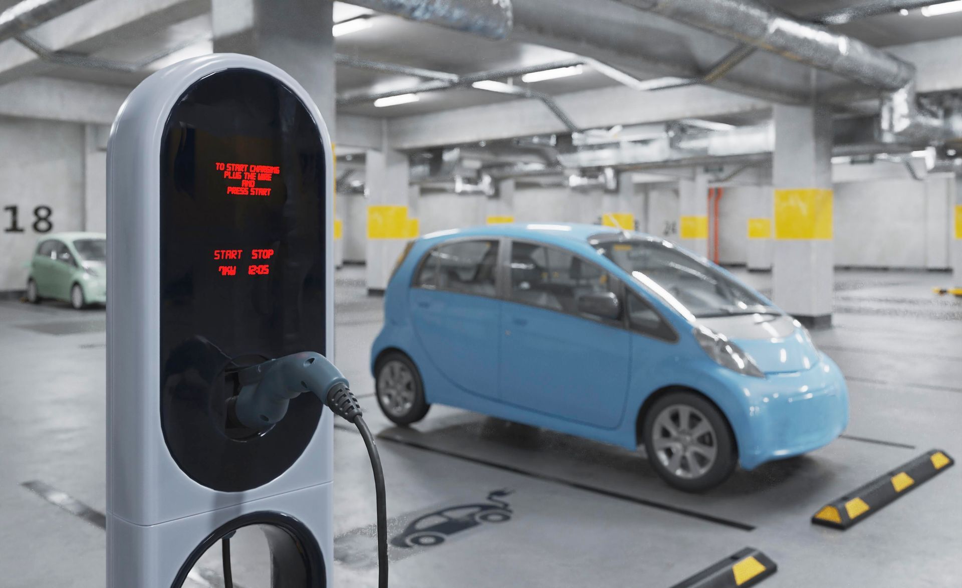 A blue electric car is being charged at a charging station in a parking garage.