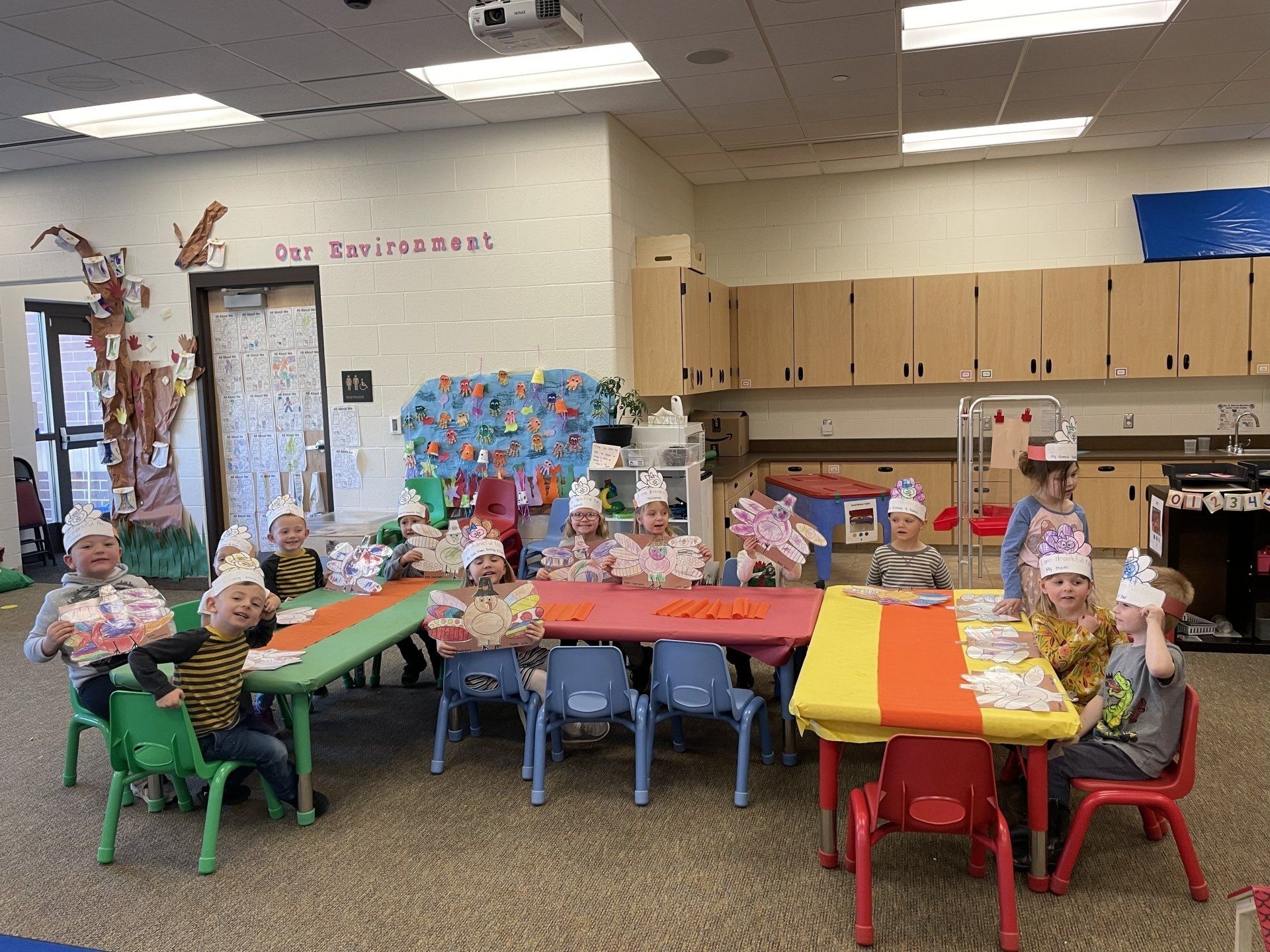 Preschoolers enjoying a thanksgiving feast