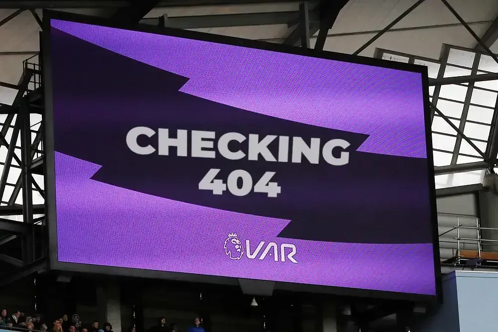 A large screen displays the message checking 404
