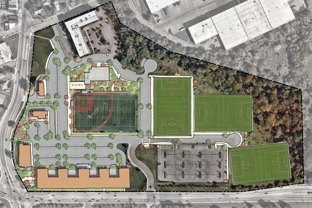 Aerial view of a site plan featuring a baseball field, multiple rectangular soccer fields, parking, and building footprints.