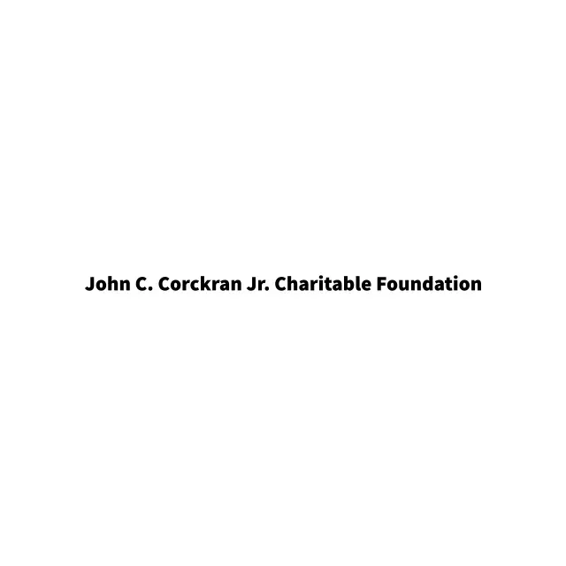 The john c. corcran jr. charitable foundation logo is on a white background.