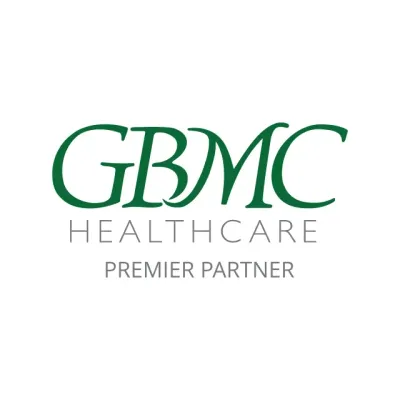 GBMC Healthcare logo with green text on a white background. Text includes "GBMC HEALTHCARE" and "PREMIER PARTNER".