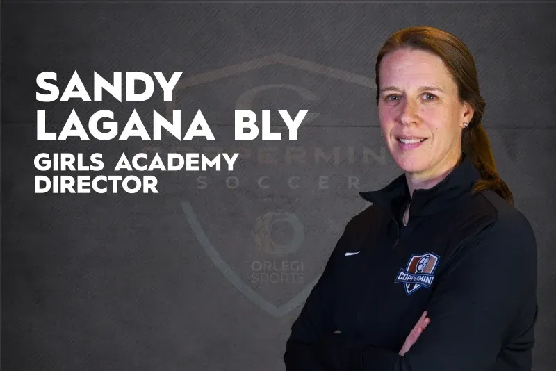 Sandy Lagana Bly, Girls Academy Director, in a black jacket against a dark background