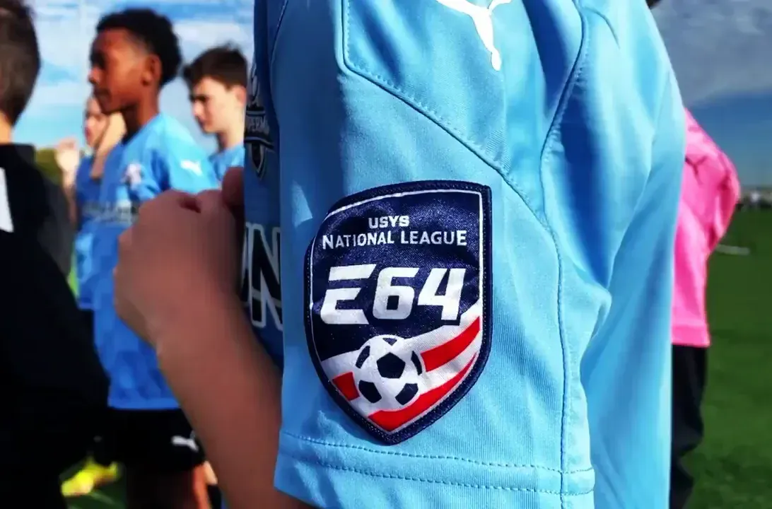 a Coppermine Soccer Club player  wearing a soccer jersey with  an Elite 64 patch,