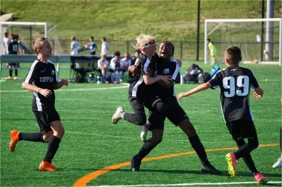 Coppermine Boy soccer players celebrating a win