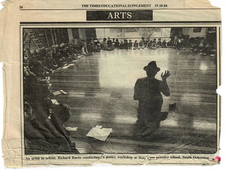 A black and white photo of a man kneeling in front of a crowd with the words arts at the top