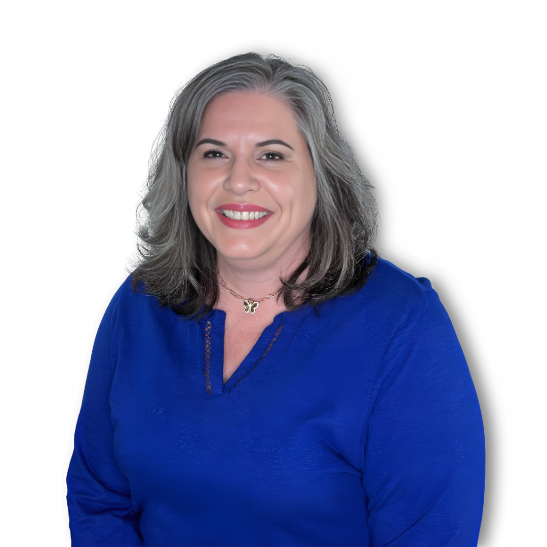 A woman wearing a blue shirt and a necklace smiles for the camera