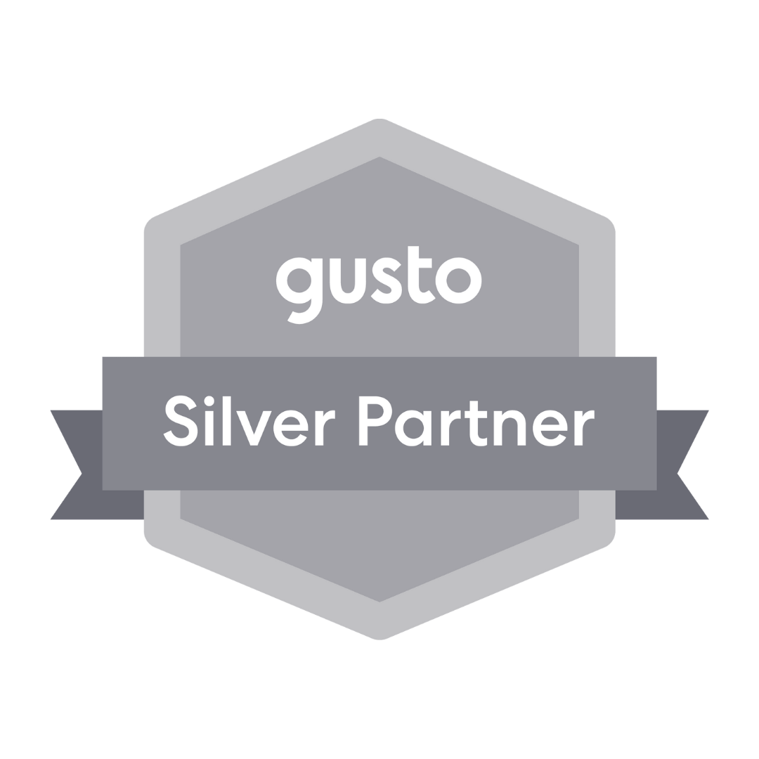 A silver partner badge with a ribbon on a white background.