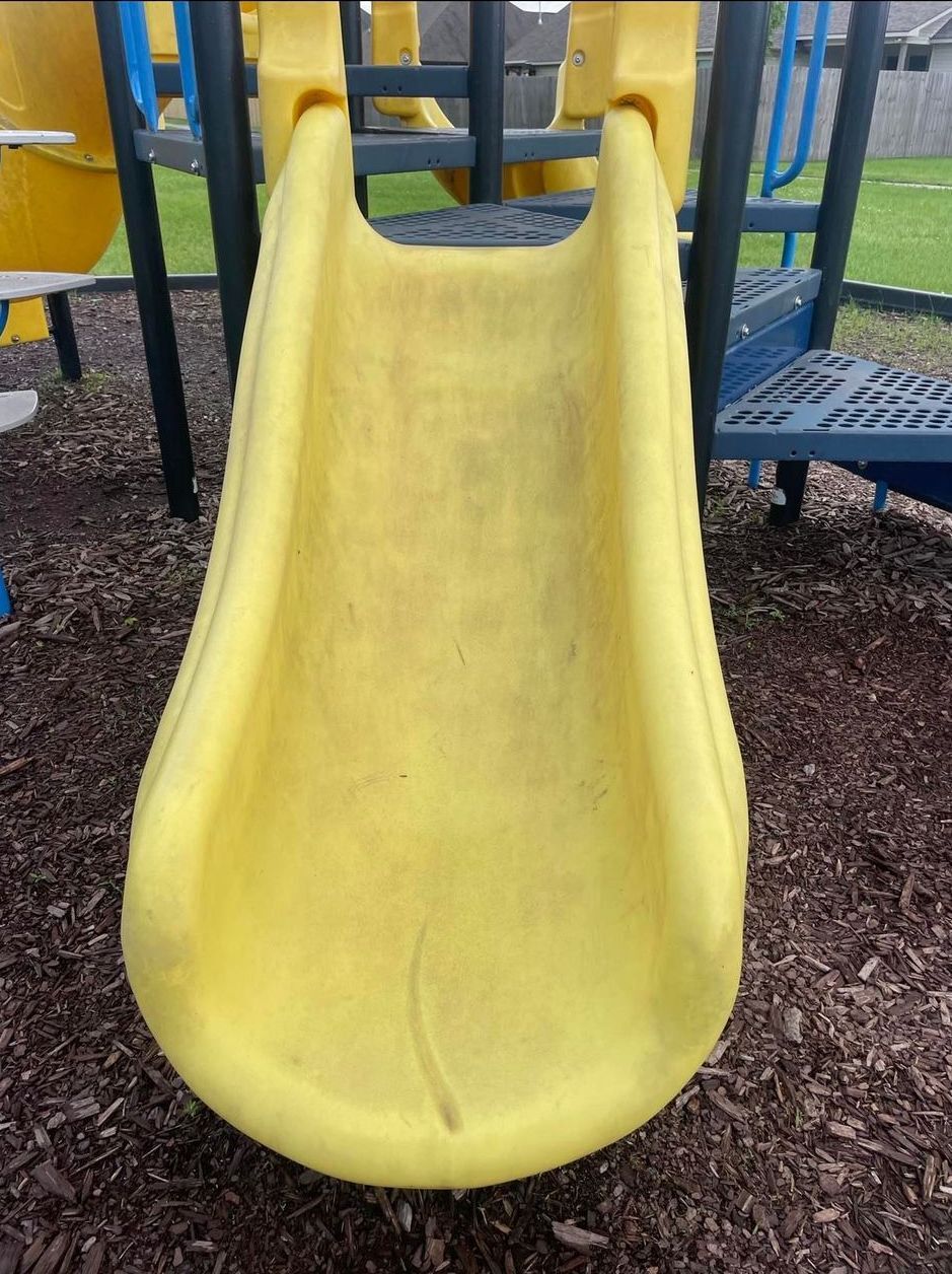dirty worn childrens playground park slide in Baton Rouge Louisiana