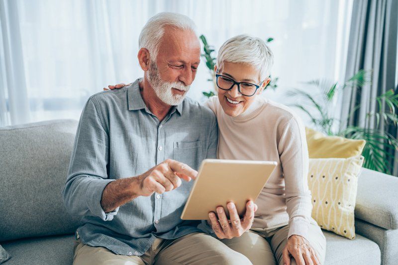 Senior Looking In Tablet — Oak Creek, WI — Health Insurance Solutions