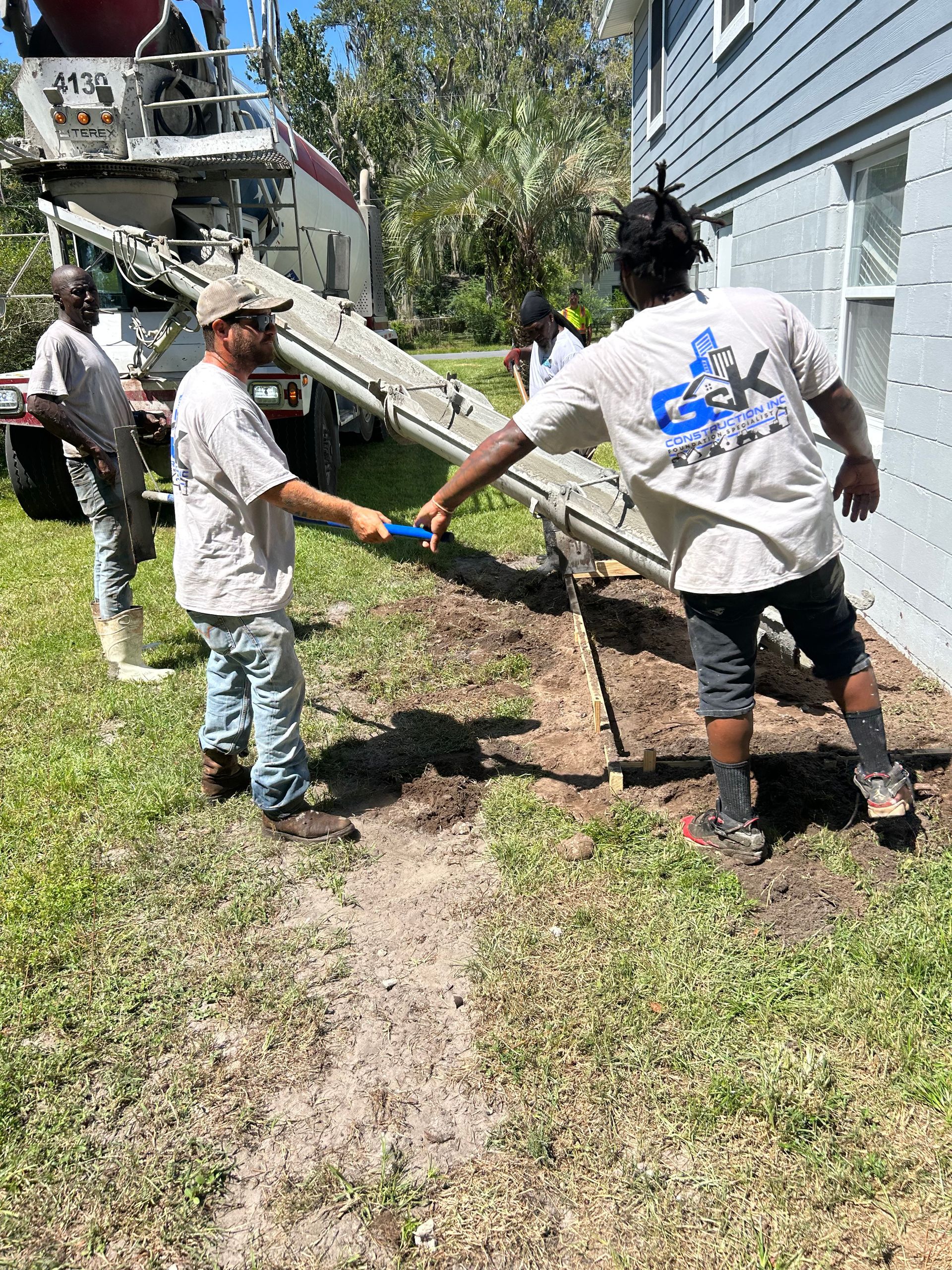 Men Working At Field — Jacksonville, FL — G -K Construction