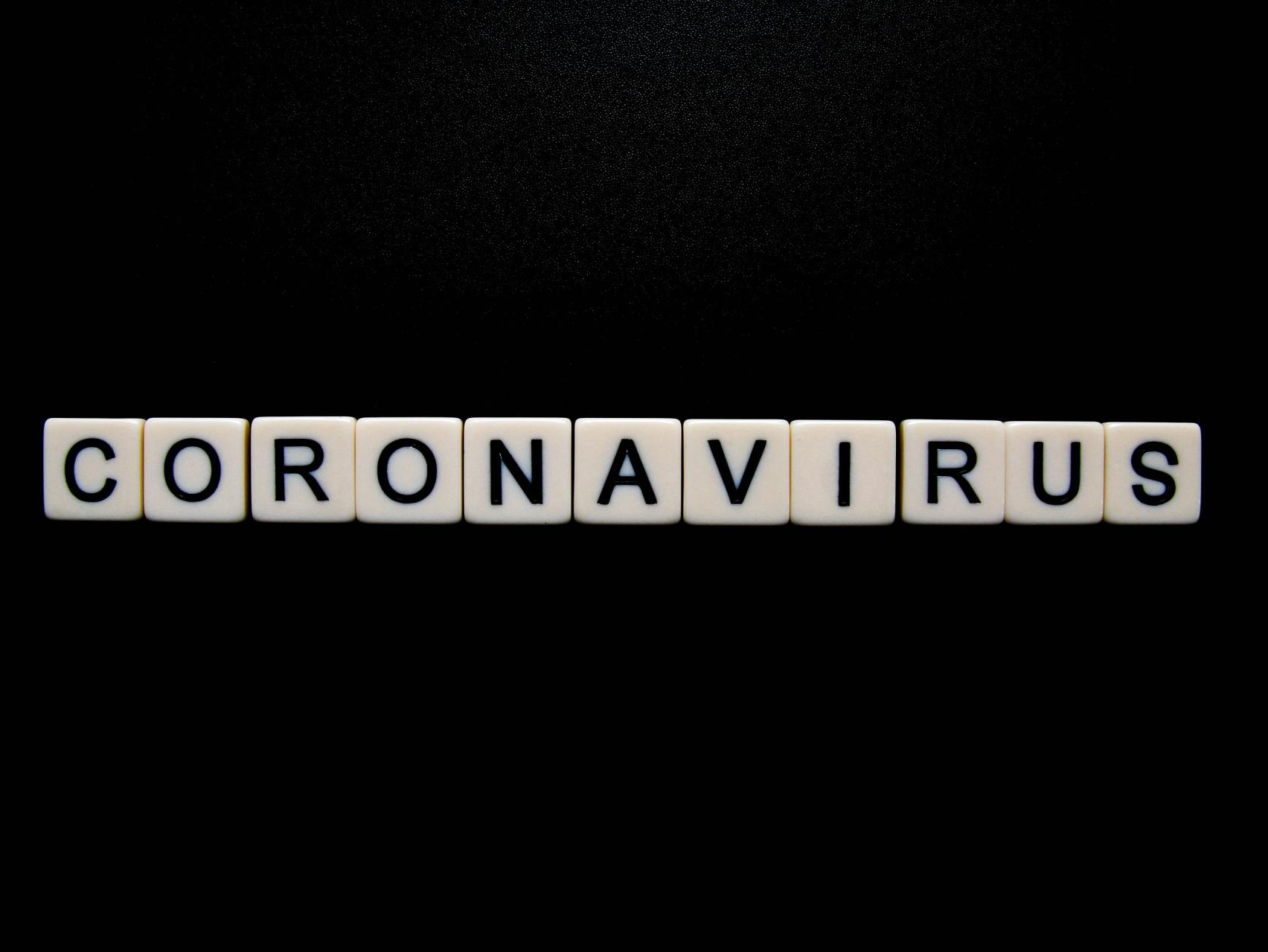 Coronavirus spelled on a shuffleboard