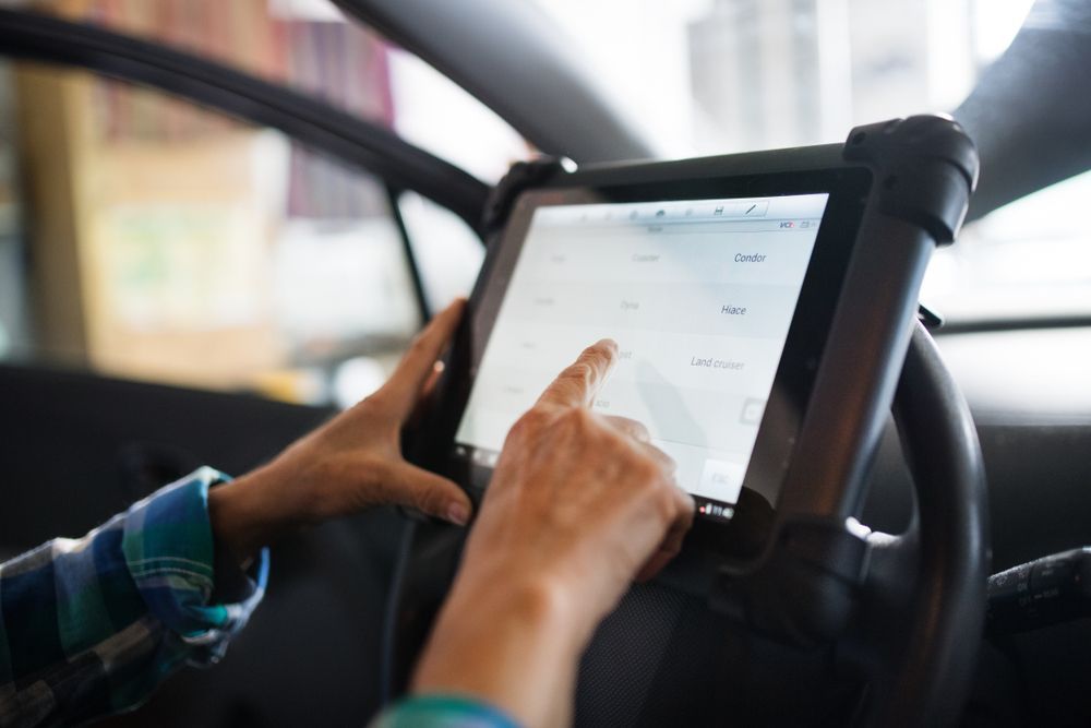 A Person is Using a Tablet in a Car — ORH Mechanical in Doolbi, QLD