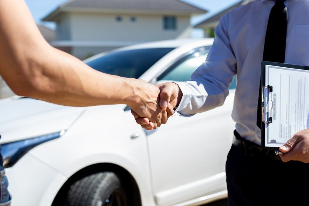 Two Man Shaking Hands in Front of a Car — ORH Mechanical in Doolbi, QLD
