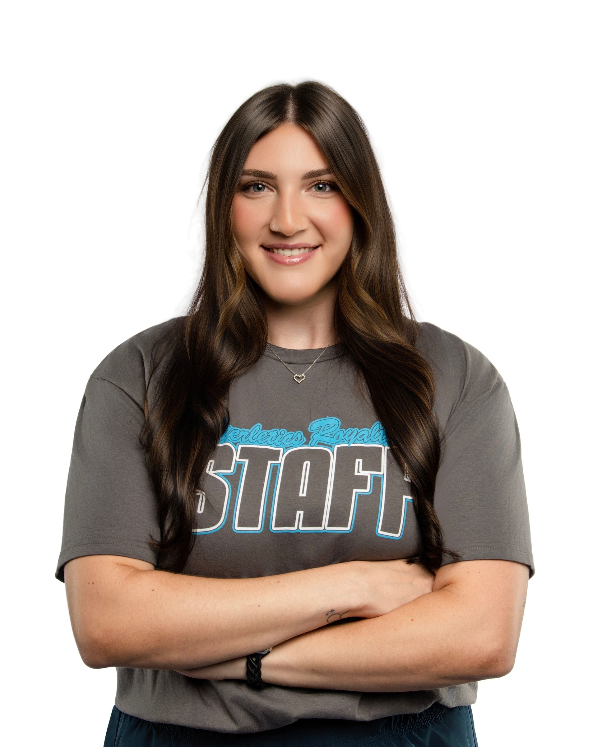 A man with curly hair and a beard is smiling.