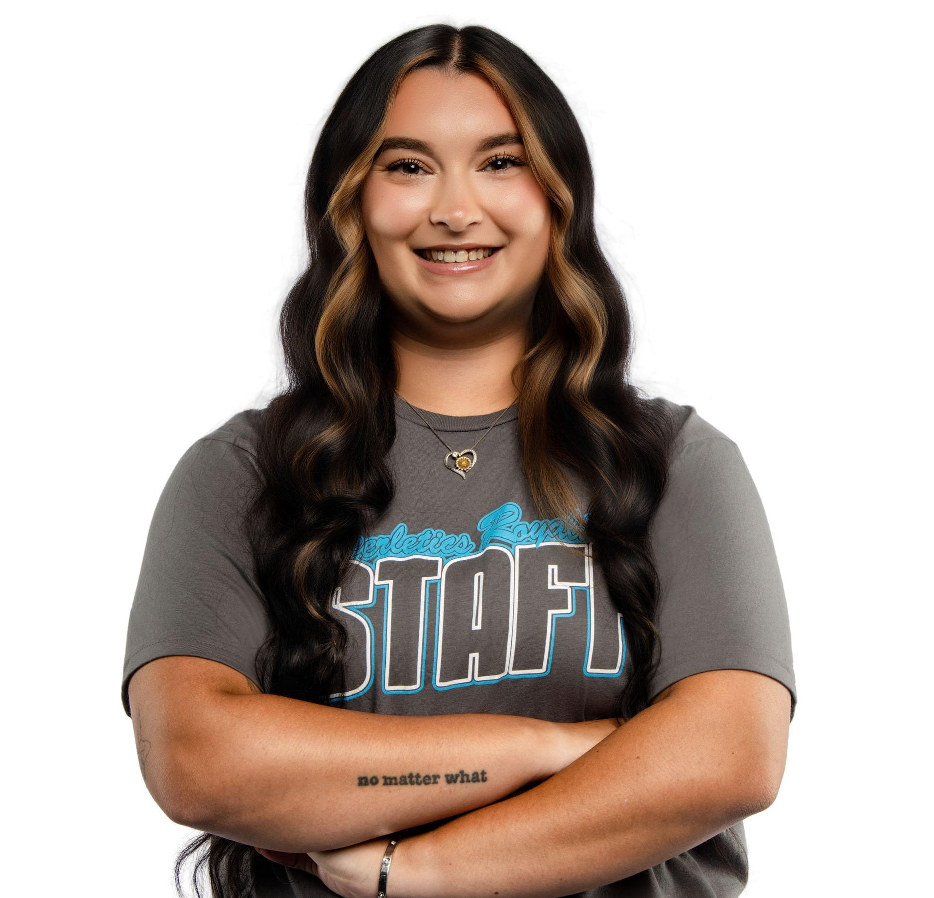 A woman wearing glasses and a white shirt is smiling.