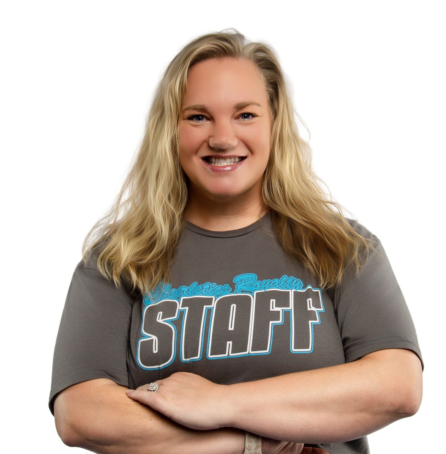 A woman wearing glasses and a white shirt is smiling.