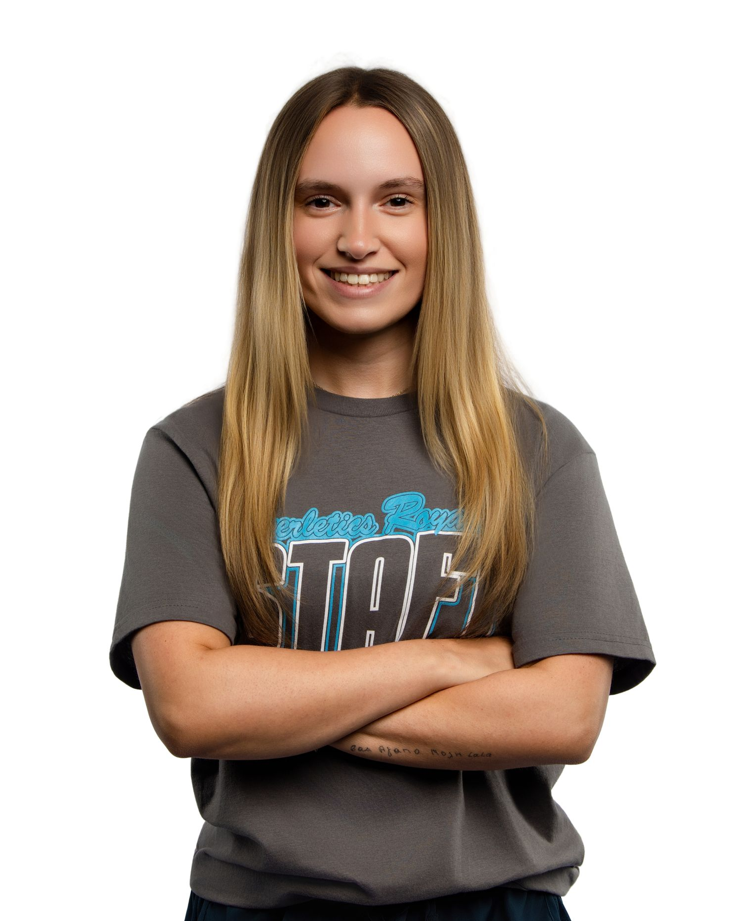 A man wearing a straw hat is smiling and looking up.