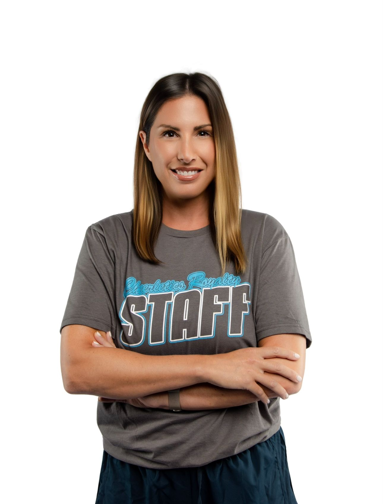 A woman in an orange shirt is smiling for the camera.