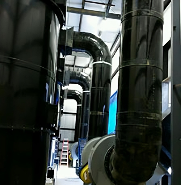A factory with a lot of pipes going through it