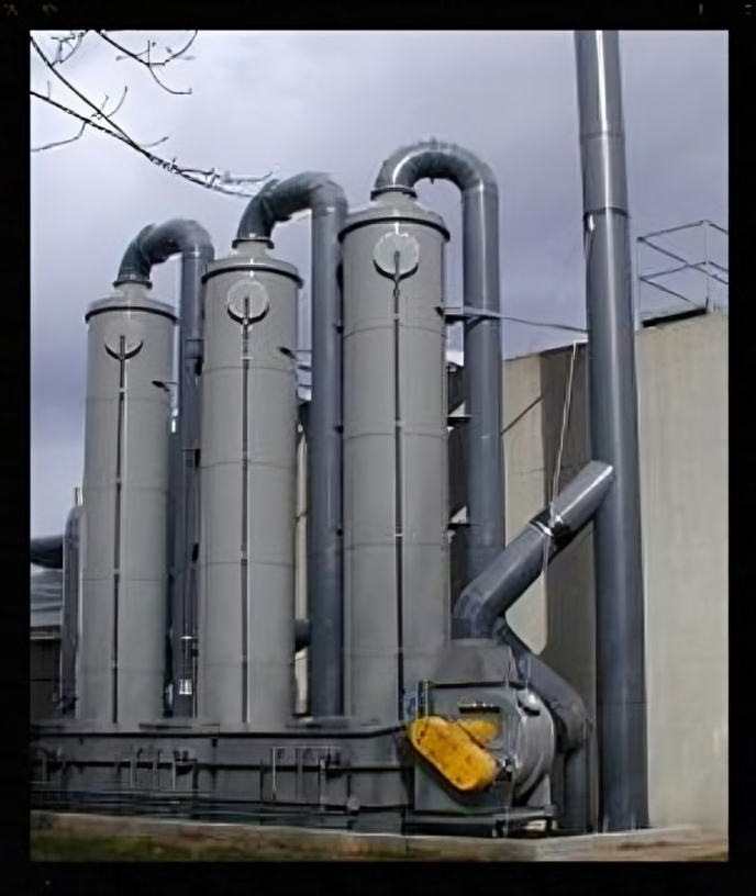 A factory with a lot of pipes and a yellow fan